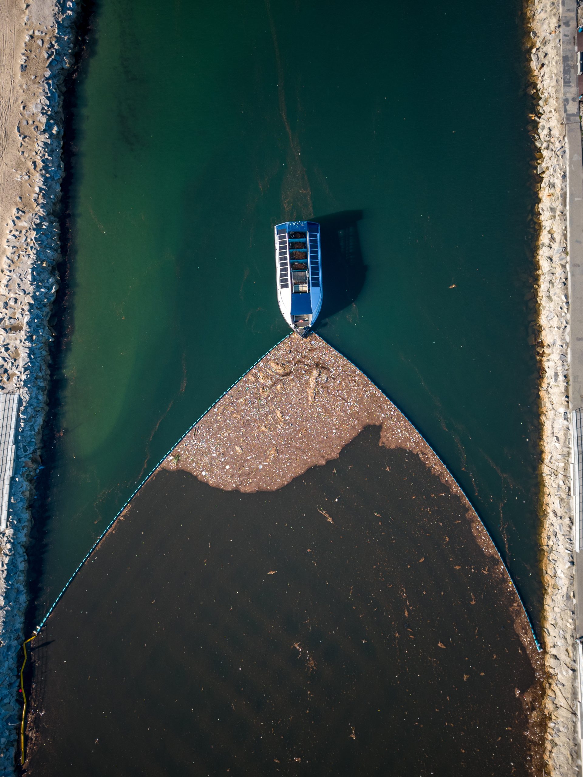 The Ocean Cleanup's Interceptor barge on a river